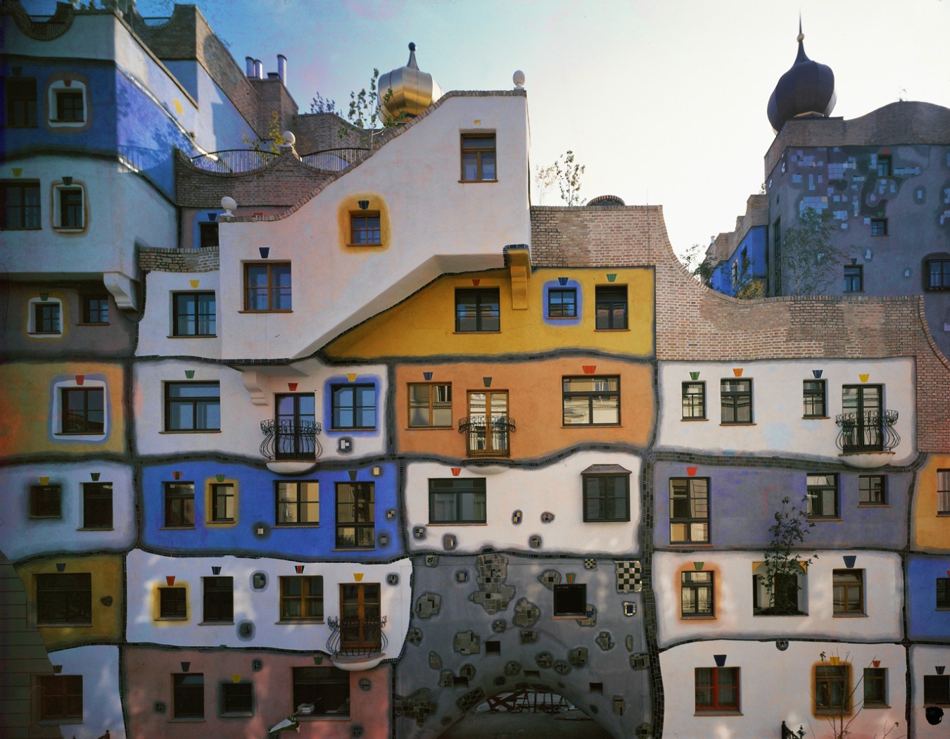 Figure 24-2: The Hundertwasser Haus in Vienna was built to provide middle-class people with beautiful, highly creative housing that promotes individuality.